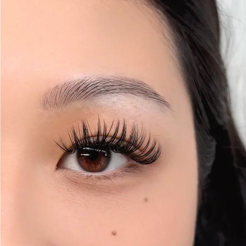 Close-up of an eye with a full set of custom lash extensions
